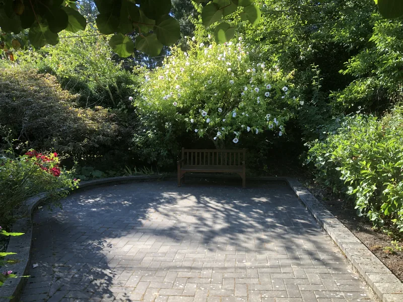 Curved Herringbone Paver Terrace & Retaining Curb